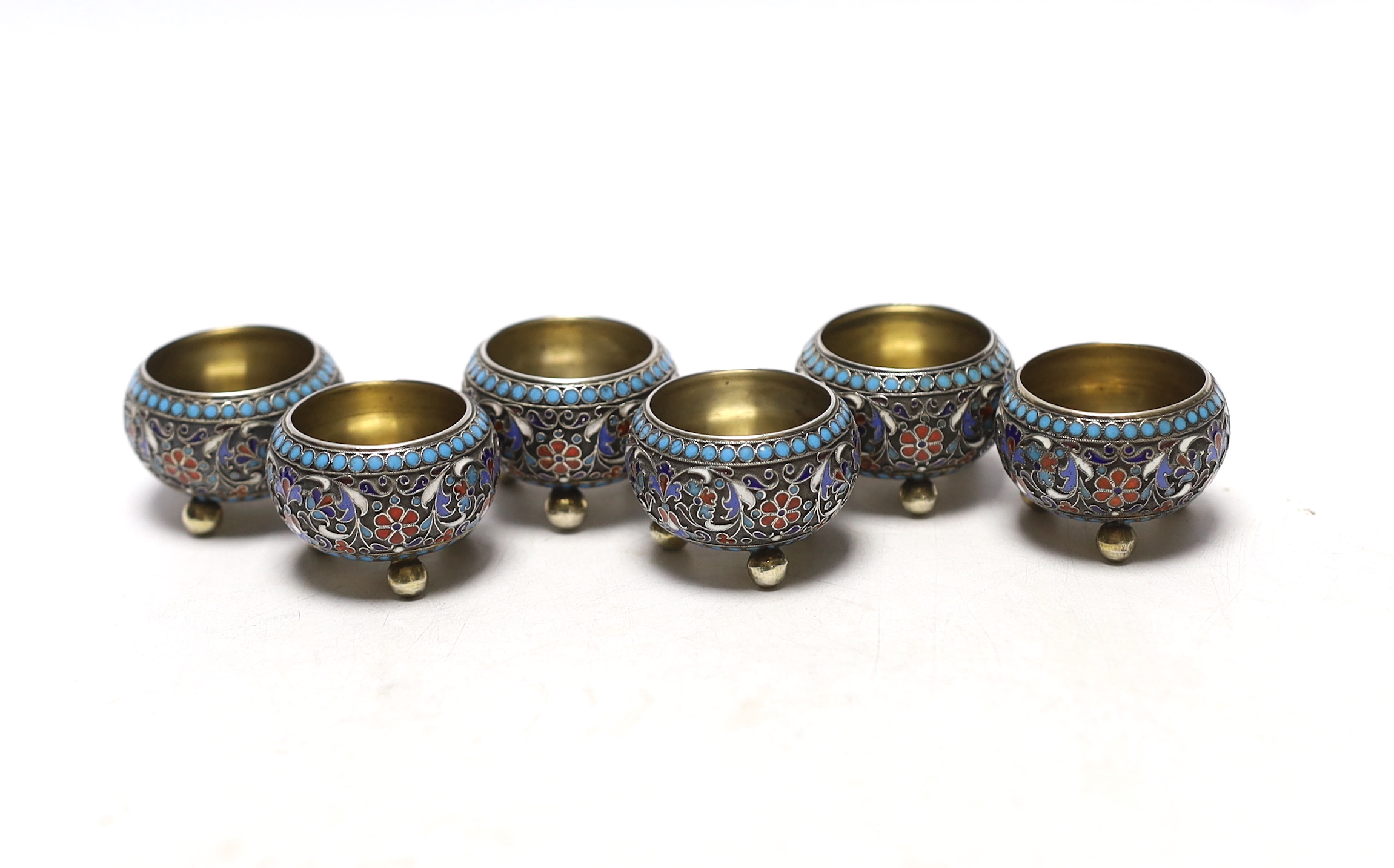 A set of six late 19th century Russian 84 zolotnik and cloisonné enamel tub salts, by Gustav Klingert, diameter 37mm.